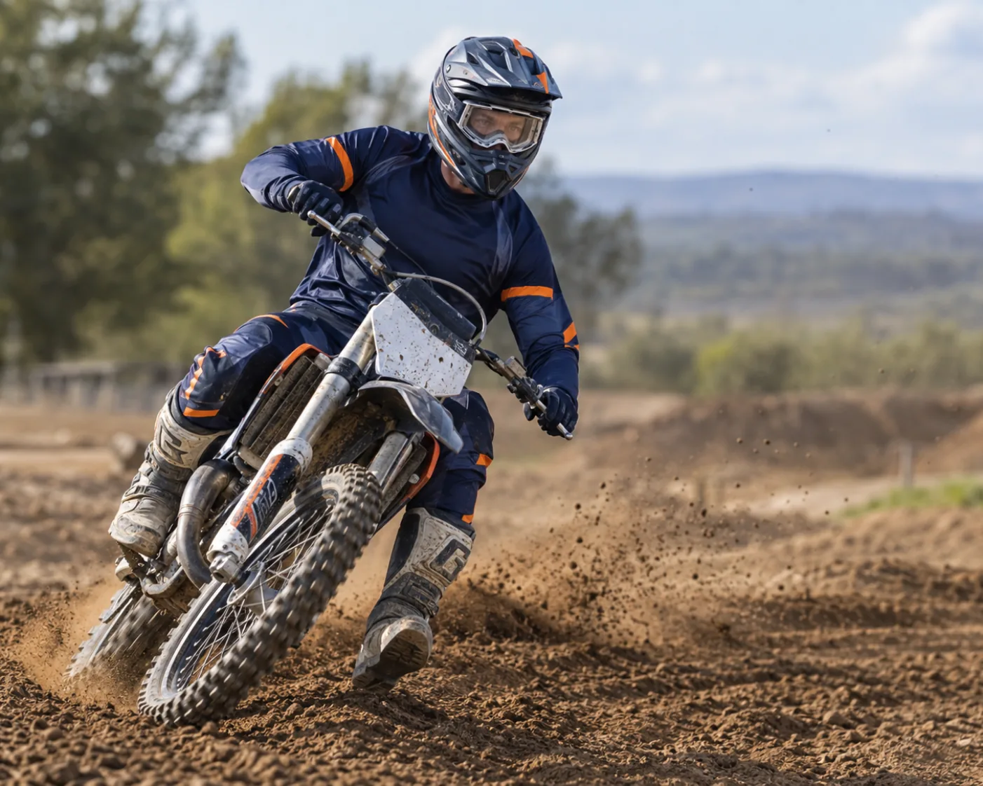 Motocross rider wearing a helmet and clear protective sports goggles.